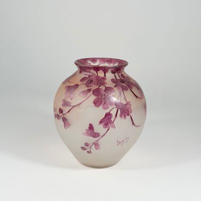 purple and white glass vase with flowers on a white background