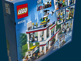 a box with a lego city set inside of it