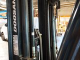 a forklift that is parked in a warehouse