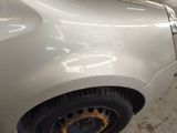 a close up of a car with a flat tire on the ground