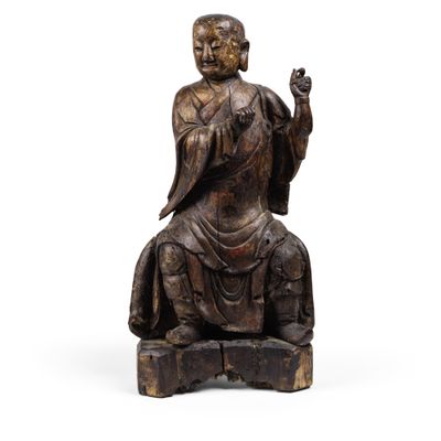 statue d'un Bouddha assis, la main levée