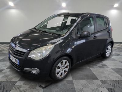 a picture of a small black car on a checkered floor