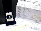 a box with a ring inside of it sitting on a table