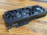 a close up of a video card sitting on top of a wooden table