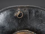 a close up of a black leather hat with a metal buckle