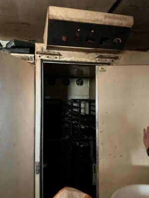 a man standing in front of a door in a room