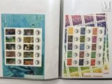 a book with stamps on the pages and a picture of a woman on the cover