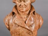 an image of a bust of a man wearing a coat