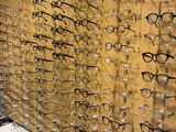 many glasses that are on display on the wall
