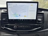the dashboard of a car with a gps device in the center of it
