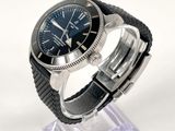 a watch that is sitting on a stand on a white surface
