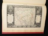 an open book with a map of china on it sitting on a table