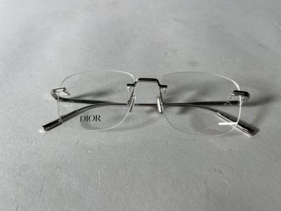 glasses on a table with the word dior written on it