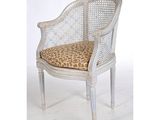 an image of a white chair with a leopard print cushion