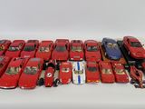 a lot of toy cars sitting on a white surface