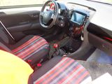 a picture of a car interior with a steering wheel and dashboard