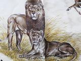 a picture of a book with a picture of lions and deers on it