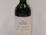 a bottle of wine that is sitting on a table