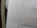 an image of a washing machine with a hose attached to it
