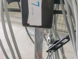 a machine that is sitting on the ground with wires attached to it