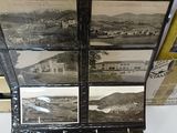 a display case with pictures of a town on it