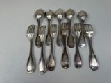 a lot of silver spoons and forks on a table