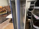 a metal cabinet in the middle of a warehouse