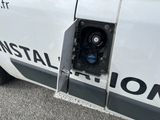 a white van with the door open and the word installation written on the side of the van