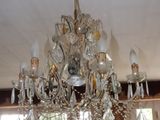 a chandelier that is hanging from the ceiling in the room