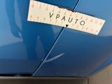 a sticker that says vauto on the side of a blue car