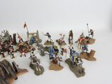 a lot of figurines that are sitting on a table