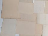 a pile of old papers sitting on a table