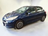 a picture of a blue car parked in a garage