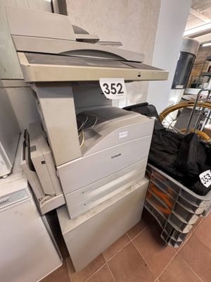 a pile of office equipment in a store with a price tag on the top of it