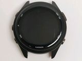 a close up of a smart watch on a white surface