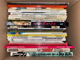 a box full of books that are stacked on top of each other