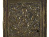 an old brass plaque with a picture of a woman and child