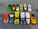 a lot of toy cars that are lined up on the floor