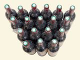 many bottles of wine that are stacked on top of each other