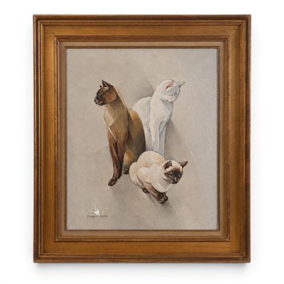 deux chats siamois et un chat siamois dans un cadre en bois