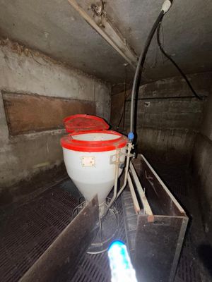 two buckets that are sitting on a shelf in a room