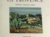 un livre sur la couverture duquel figure une image représentant un paysage