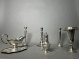 three silver objects sitting on a table next to each other