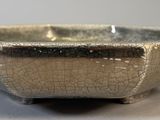 a silver bowl that is sitting on a table
