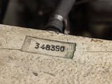 a close up of a piece of metal with a number on it