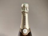 a bottle of champagne that is sitting on a table