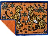an image of a rug with two leopards on it