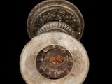 a close up of a rusted door knob on a black background