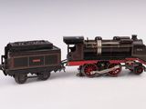 un train noir et rouge sur un fond blanc