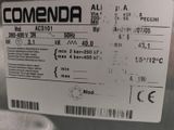 a label on the back of a machine that says comendia